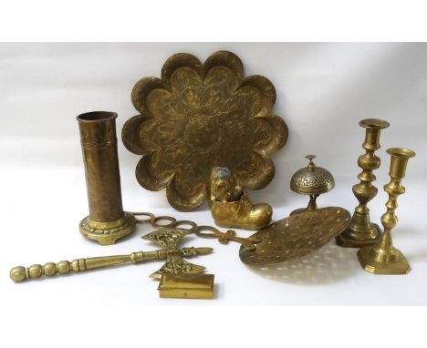 SELECTION OF DECORATIVE AND OTHER BRASSWARE
including two skimming spoons, a table bell, a decorative axe, a horse head on sh