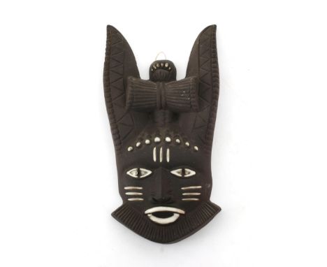 Jaap Ravelli (1916-2011) A ceramic wall mask depicting a figure with long ears, 1950s, signed to the reverse. 17 x 9 x 3,5 cm