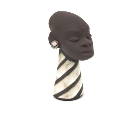 Jaap Ravelli (1916-2011) A ceramic African female head with copper earrings (some corrosion) and white glazed linear decorate
