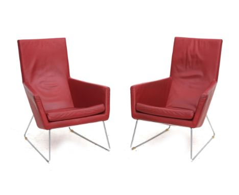 Gerard van den Berg (1947) Two red leather easy chairs on chromium plated metal frames, model Don, produced by Label, modern,