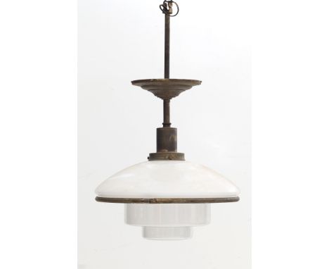 C.F. Otto Müller A clear and opaline glass hanging lamp suspended by a nickle-plated tubular steel pendulum, jaren '30, the g