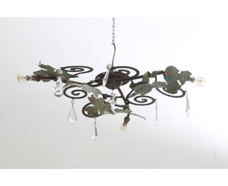 Maroeska Metz (1959) A wrought iron ceiling lamp with decoration of leafs, with cut crystal pendants. 50 x 55 cm.