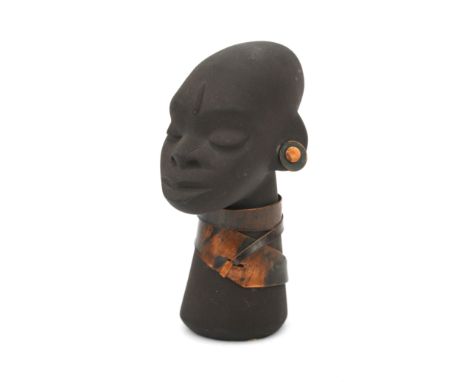 Jaap Ravelli (1916-2011) A ceramic African female head with copper necklace and earrings, 1950s, signed underneath and with r