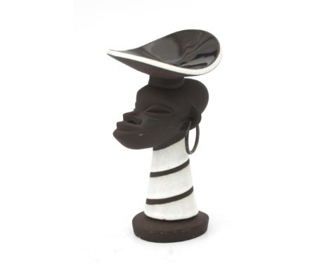 Jaap Ravelli (1916-2011) A ceramic figural candlestick shaped as an African female head with dish on her head, with copper ea