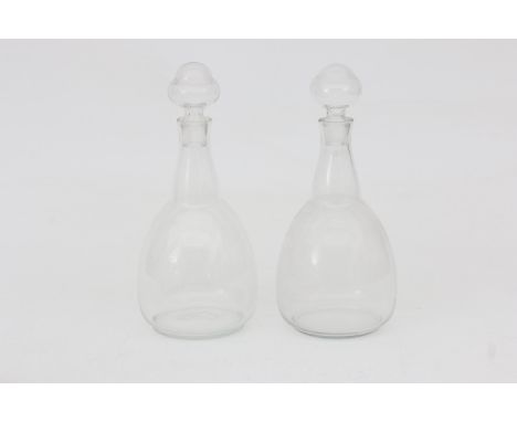 Karel Petrus Cornelis de Bazel (1869-1923) Two clear glass bottles and stoppers of the service D, produced by Glasfabriek Lee