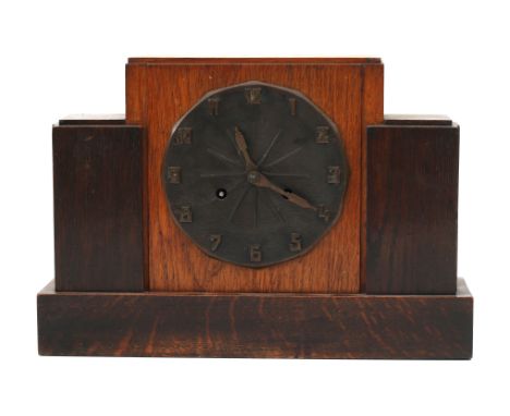Haagse Stijl An oak mantle-clock partly dark stained, with patinated brass dial, 1930s. 26 x 37,5 x 12,5 cm. (hxwxd)