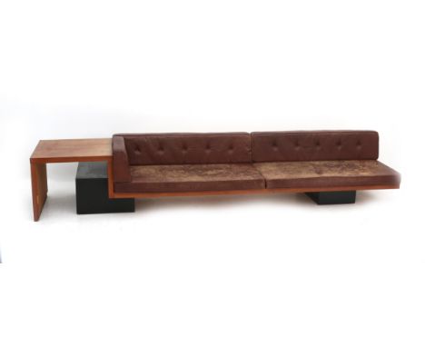 Wim den Boon (1912-1968) A large solid oak sofa on cubical ebonised wooden plinths, with integrated occasional table, the cus