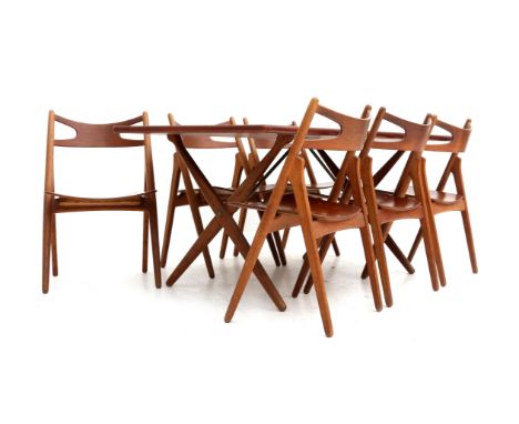 Hans J. Wegner (1914-2007)&nbsp;A teak model AT 303 dining table with six CH 29 Sawbuck chairs, oak and teak, produced by: An