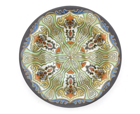 Plateelbakkerij Zuid Holland, Gouda A ceramic wall plate, pattern Tokio, with painted manufacturer's marks to the reverse, ye
