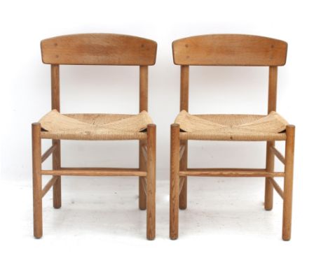 Børge Mogensen (1914-1972) Two oak dining chairs with papercord woven seats, model J39, produced by FDB Møbler, Denmark, desi