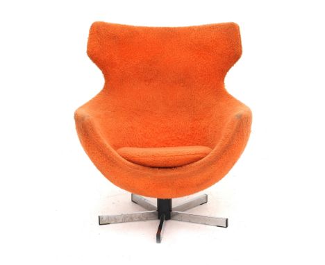 Pierre Guariche (1926-1995) An orange upholstered swivelling easychair on chromium plated and black lacquered metal base, mod