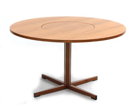 Nanna Ditzel (1923-2005) A circular teak veneered and lacquered dining table with central rotatable panel, on cross-leg metal