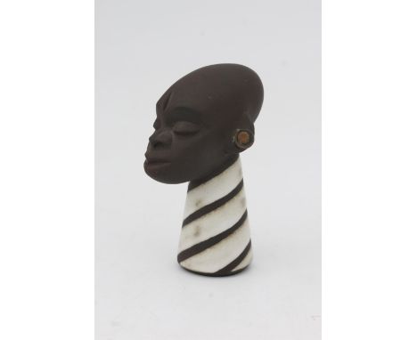 Jaap Ravelli (1916-2011) A ceramic African female head with copper earrings and white glazed linear decorated neck, 1950s, si