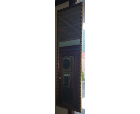An Early 20th Century Gilt Framed Oval Bevelled Wall Mirror, 35 x 25ins.
