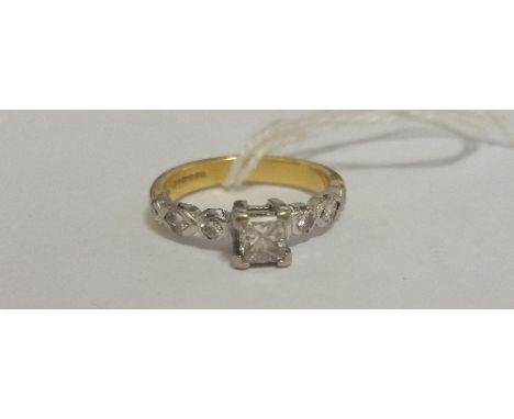 A Diamond Solitaire Ring with Princess Cut Diamond set in a 14ct white gold four claw setting, three diamonds set in shoulder