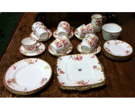 A Victorian Floral Part Tea Set with 11 cups and saucers, 5 plates, 2 cake plates, milk & sugar