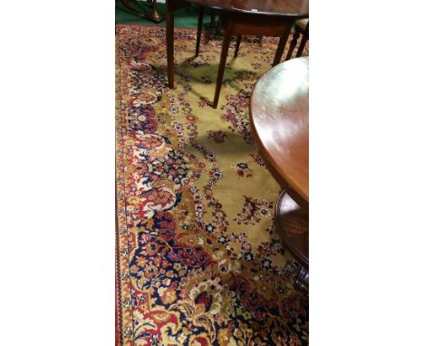 Large English Persian Style Carpet; with mustard coloured ground with floral decoration 340 x 250cm.