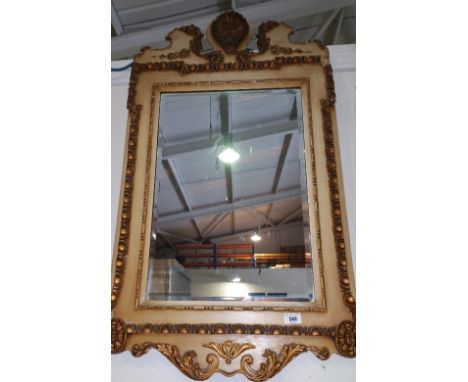 A George Third Style Cream and Gilt Framed Wall Mirror; 36" high x 21" wide.