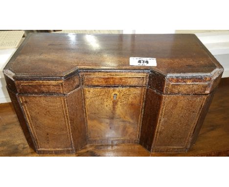 A Georgian Inverted Breakfront Mahogany Tea Caddy, having boxwood inlay, opening to reveal three lidded compartments.