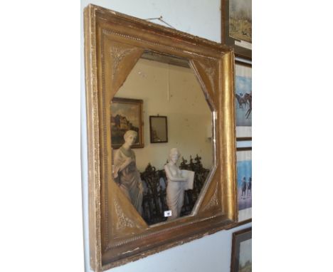A 19th Century Timber Gilt Irish Wall Mirror; with canted corner and moulded frame.