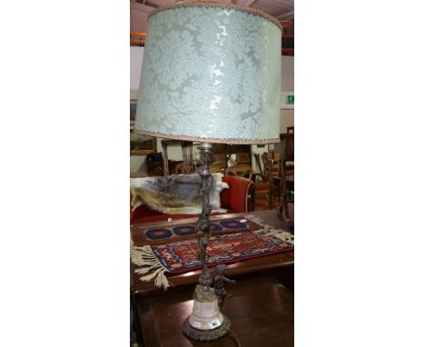 A 19th Century Metal & Marble Table Lamp with foliate support with seated cherub, with shade.