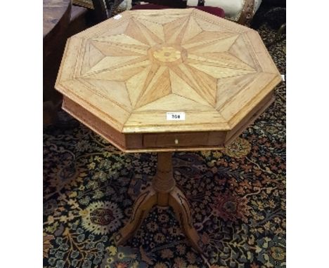A 19th Century Oak Specimen Occasional Table, the octagonal segmental inlaid top with moulded edge on a carved tripod base wi
