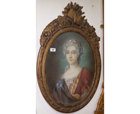 A 19th Century Style Pastel Portrait of a Lady; in an oval gilt frame with musical trophy surmount.