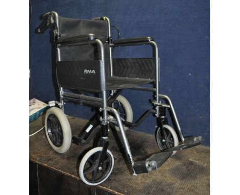 A ROMA MEDICAL FOLDING WHEELCHAIR, with two footrests