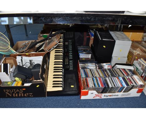 THREE BOXES AND LOOSE MISCELLANEOUS ITEMS to include a group of vintage badminton rackets, a Kawai X30 electric keyboard (unt