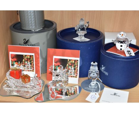 A GROUP OF BOXED SWAROVSKI CRYSTAL CHRISTMAS THEMED FIGURES, comprising Reindeer no 214821, Sleigh with two presents no 20516