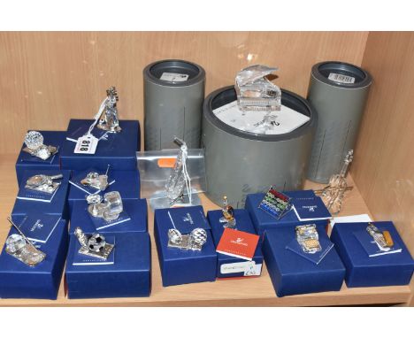 A GROUP OF BOXED SWAROVSKI CRYSTAL ITEMS, comprising Crystal Memories sports trophies: American Football, Soccer, Ice Hockey,