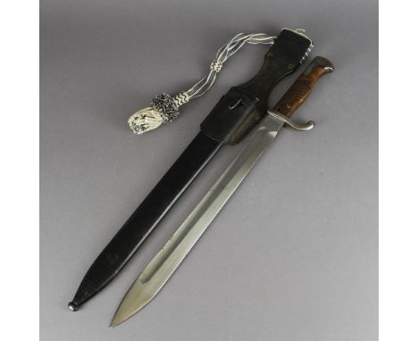 A First World War German mauser bayonet dated 1917 contained within steel scabbard, leather frog and dress knot Good overall 