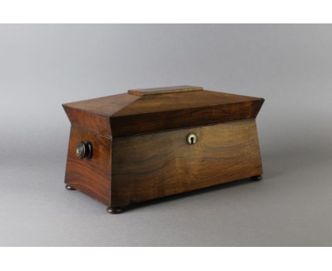 A Victorian rosewood sarcophagus shaped tea caddy, fitted two lidded compartments, 33cm x 17cm x 17cm high Lacking mixing bow