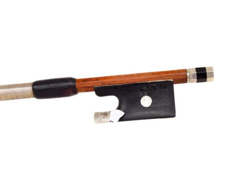 Silver mounted violin bow, unstamped, the stick round, the ebony frog inlaid with pearl eyes and the ebony adjuster with two 