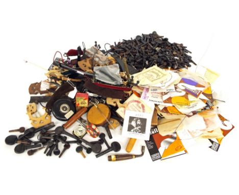Quantity of various violin making tools; also a large quantity of stringed instrument fittings including pegs, bridges, strin