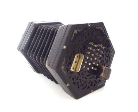 Lachenal & Co English forty-eight button concertina, the pierced ebonised ends with engraved silvered floral motifs to the co