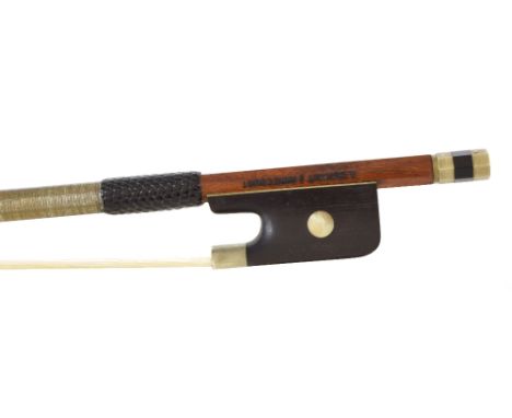 French nickel mounted violin bow by and stamped G. Duhaut a Mirecourt, the stick octagonal, the ebony frog inlaid with pearl 