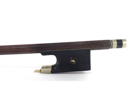 Nickel mounted violin bow stamped J. Martin, the stick round, the ebony frog inlaid with pearl eyes (both missing) and the eb