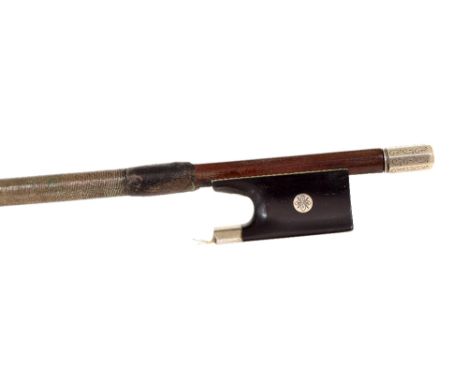 Silver mounted violin bow circa 1900, unstamped, the stick round, the ebony frog inlaid with engraved silver eyes and with a 