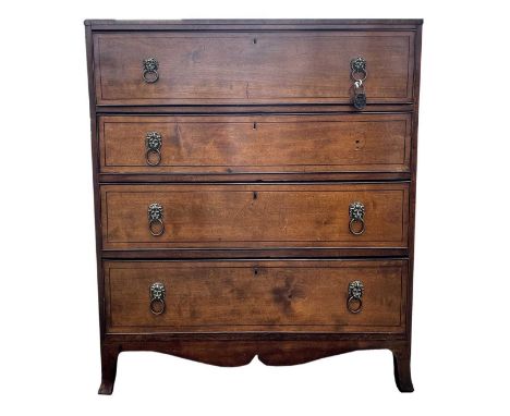 A George III mahogany secretaire chest, the large frieze drawer opening to reveal a fitted interior, above three long drawers