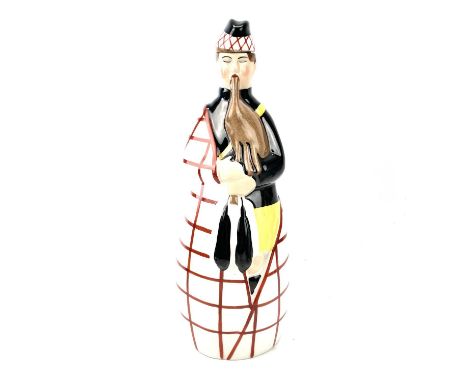 An Art Deco Robj, Paris, porcelain decanter/flask and cover, modelled as a Scottish Bagpiper, height 27cm.No condition issues