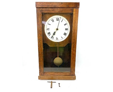 A Gledhill-Brook oak case glazed time recorder wall clock, fitted with a fusee movement, incomplete and the dial defaced, hei