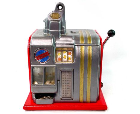 A vintage Columbia table top one armed bandit slot or fruit machine, with later red painted finish, complete with key, height