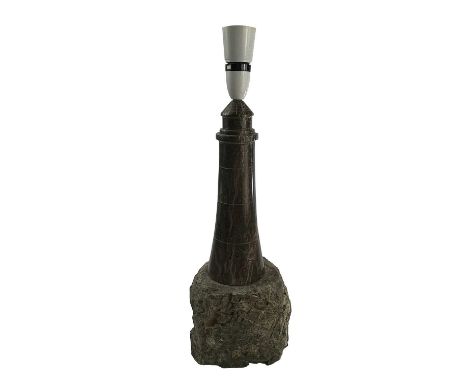 A Cornish serpentine turned and polished lighthouse table lamp on a rock base, height 38cm.