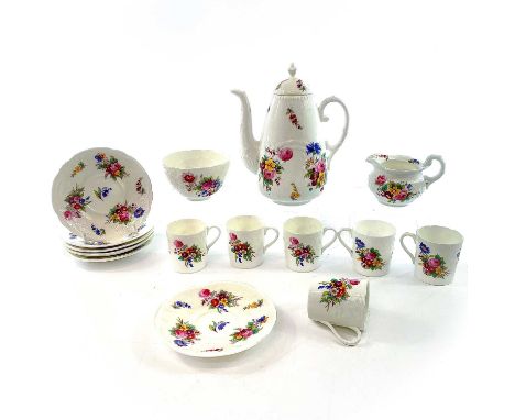 A Coalport porcelain part coffee service decorated with floral sprays comprising: coffee pot and cover, milk jug, sugar bowl,