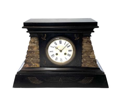 A French Egyptianesque black slate and marble mantle clock, circa 1890, with engraved motifs and fluted stepped sides, the ei