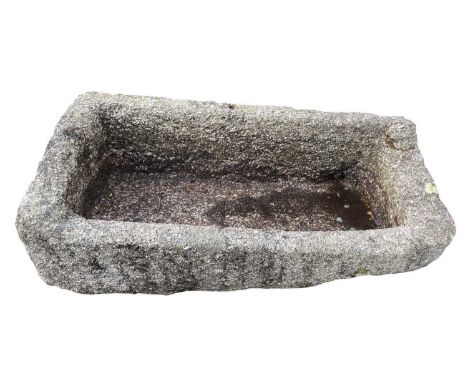 A large granite trough of rectangular form. Maximum height 39cm, width 107, depth 48cm.