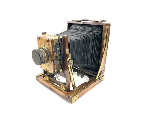 A W.Butcher &amp; Sons National Camera, 1/4 plate folding camera together with a plate negative of a family portrait.