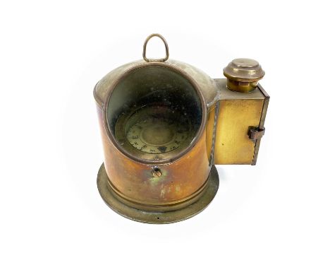 A ship's brass binnacle compass, early 20th century, fitted with a side burner, height 25cm.