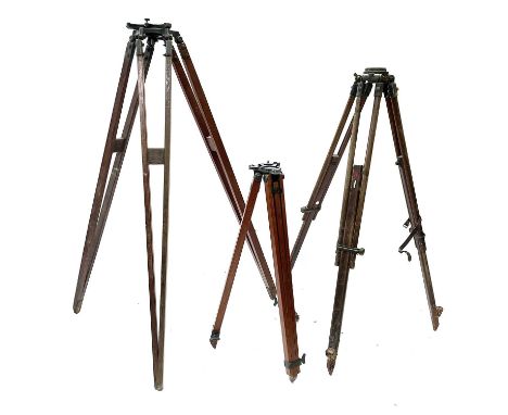 A 20th century theodolite adjustable tripod stand with lacquered brass mounts, minimum height 84 maximum 141cm together with 